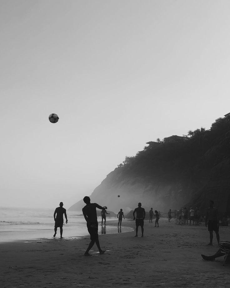 People playing football on the beach in Brazil