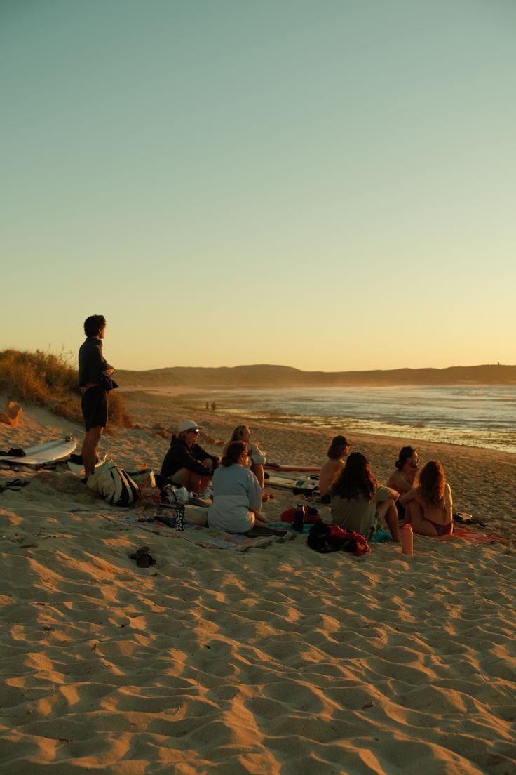 Friends on the beach watching sunset