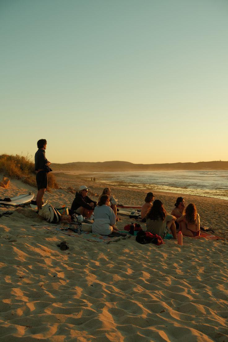 Friends watching the sunset on the beach in Hossegor