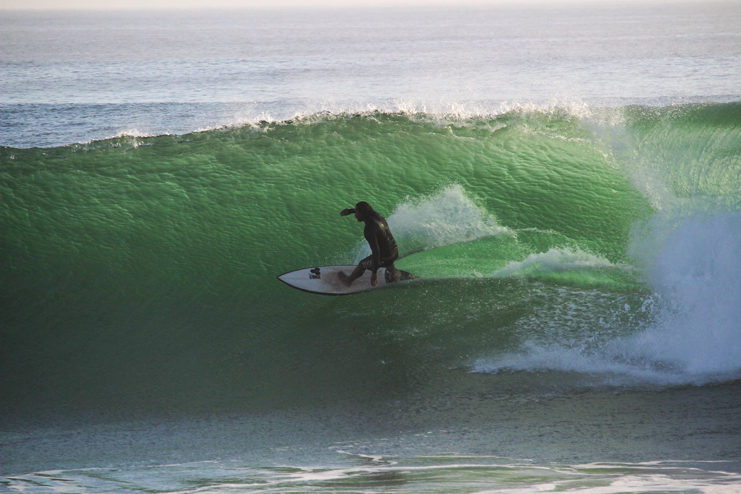 Surfer taking a wave in Anchor Point, Morocco