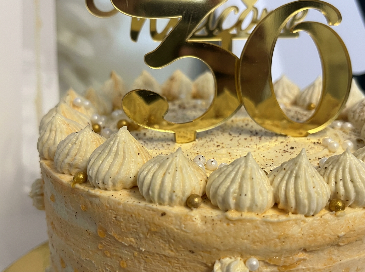 Cream Rosette Milestone Cake — closeup view