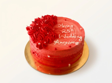 Red ombre buttercream cake with piped red rosettes and white and red pearls