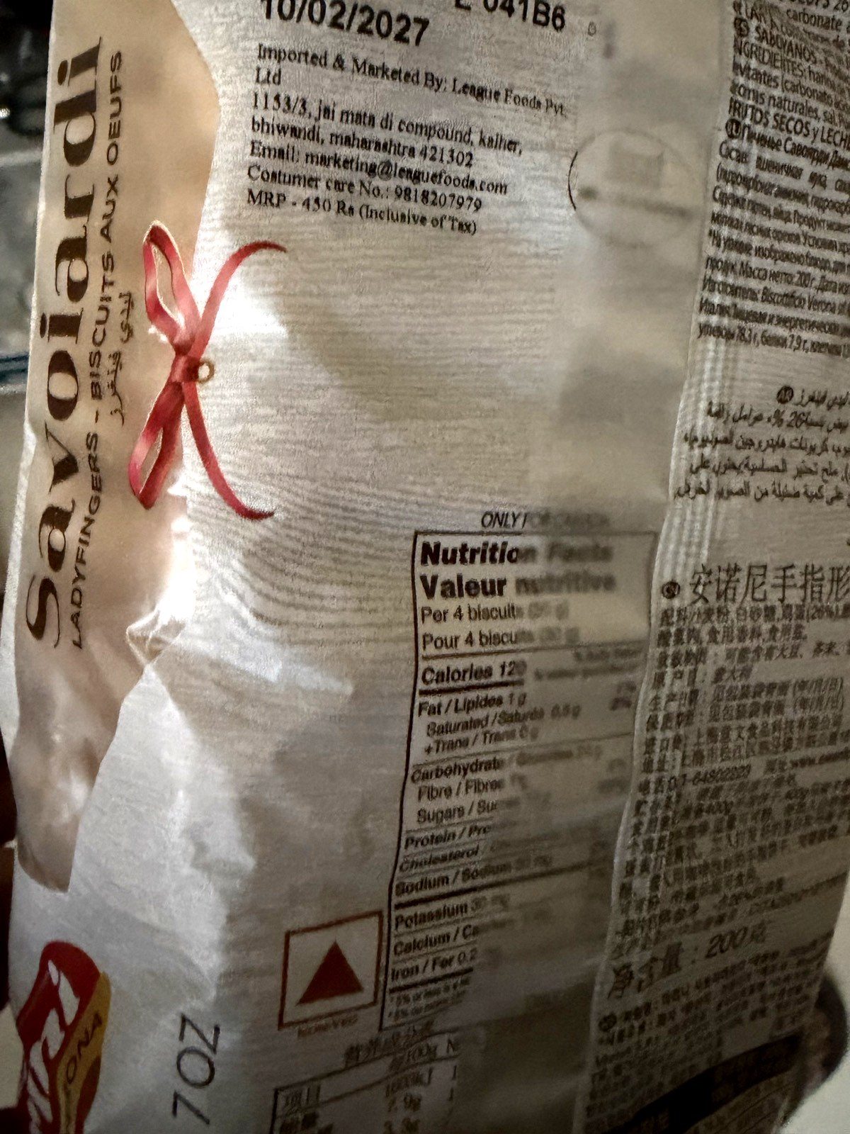 The back of a store-bought savoiardi pack: 'Ladyfingers — biscuits aux oeufs' (biscuits with eggs), with the non-vegetarian mark on the label