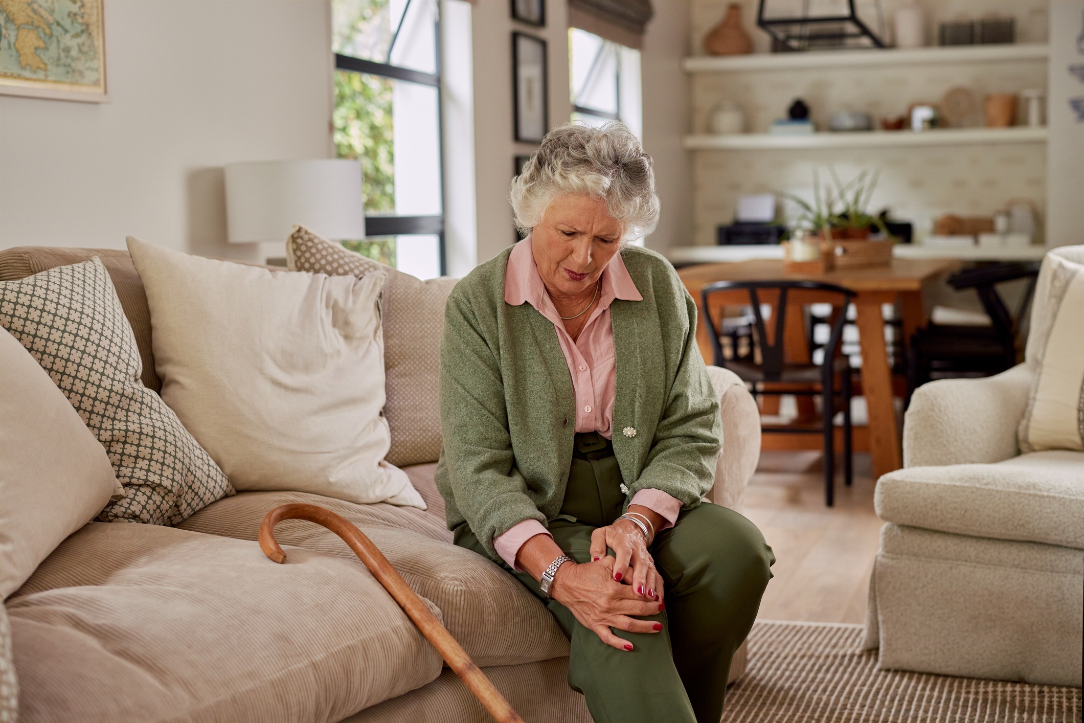 Woman 60 and up experiencing arthritis pain