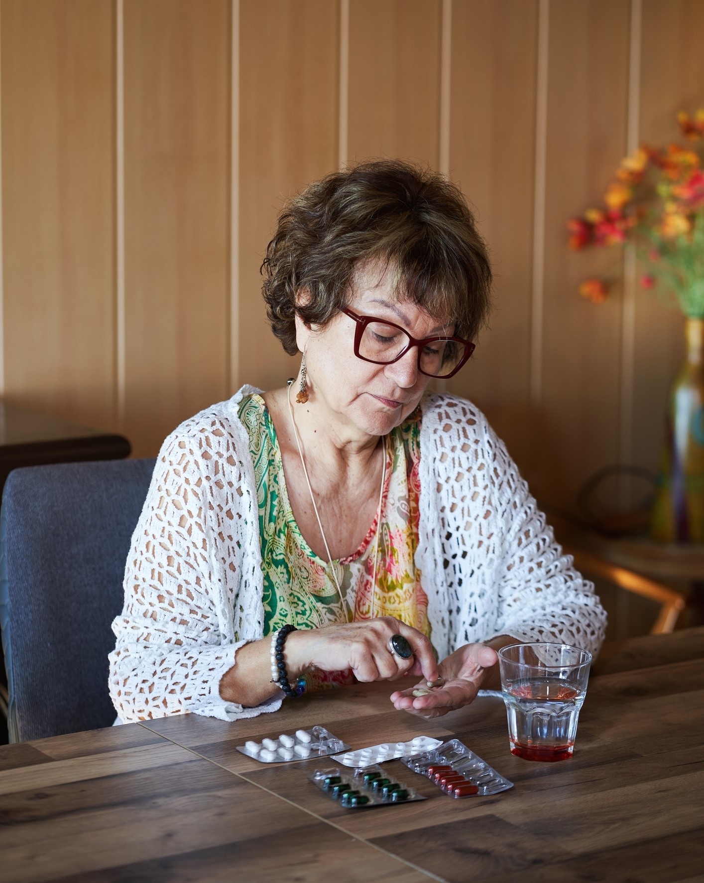 Female 65+ taking her medicine