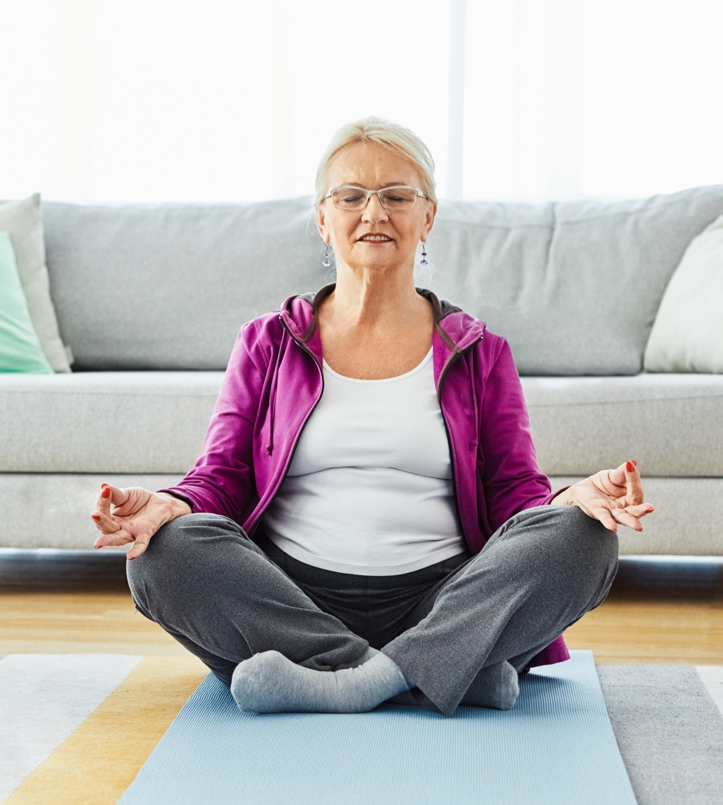 Woman 60+ doing at-home yoga
