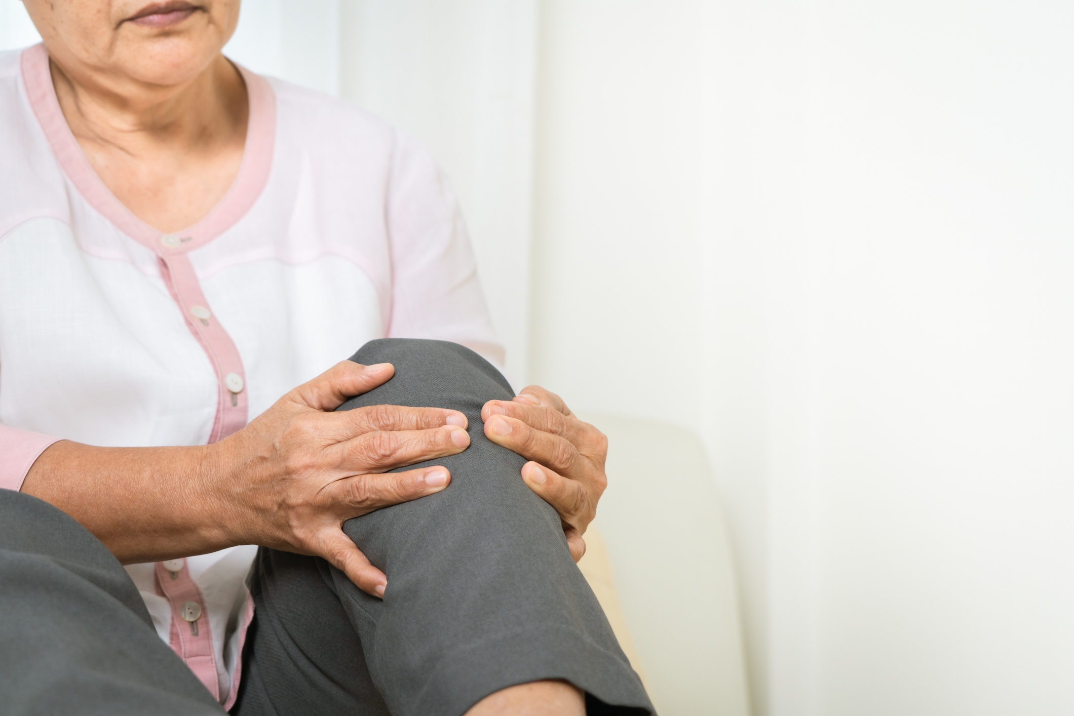 Woman holding knee