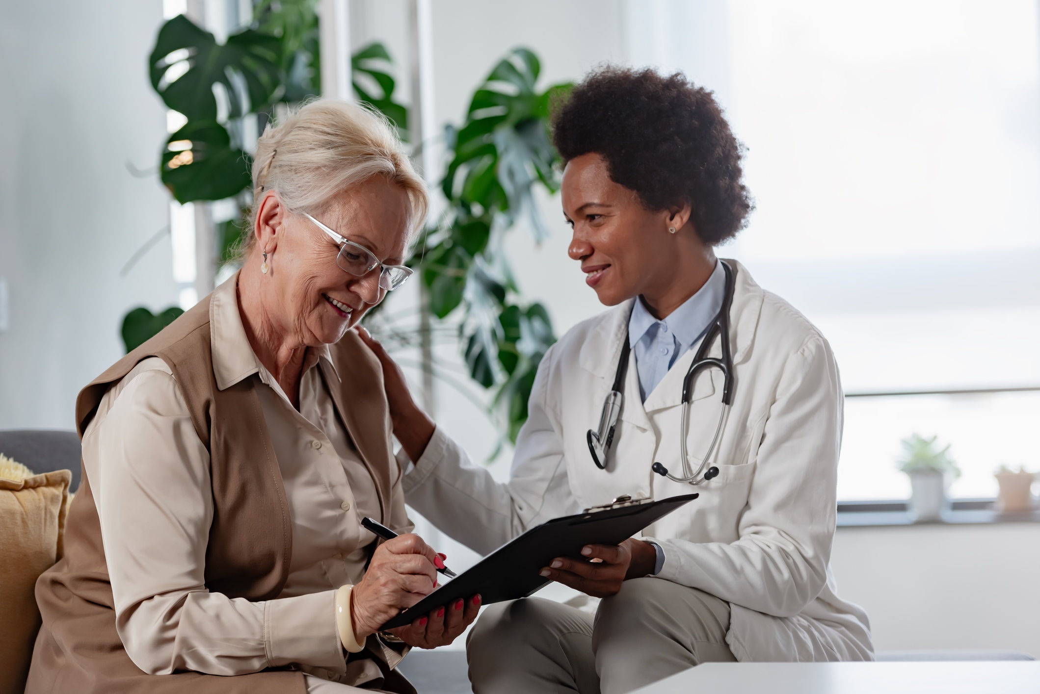 Provider helping patient with vitamins