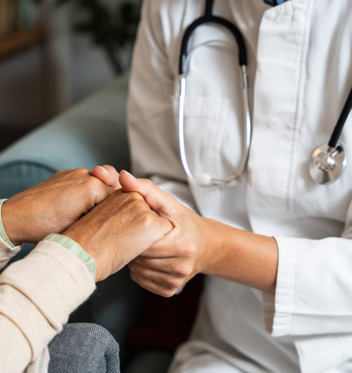 Provider holding patient's hand