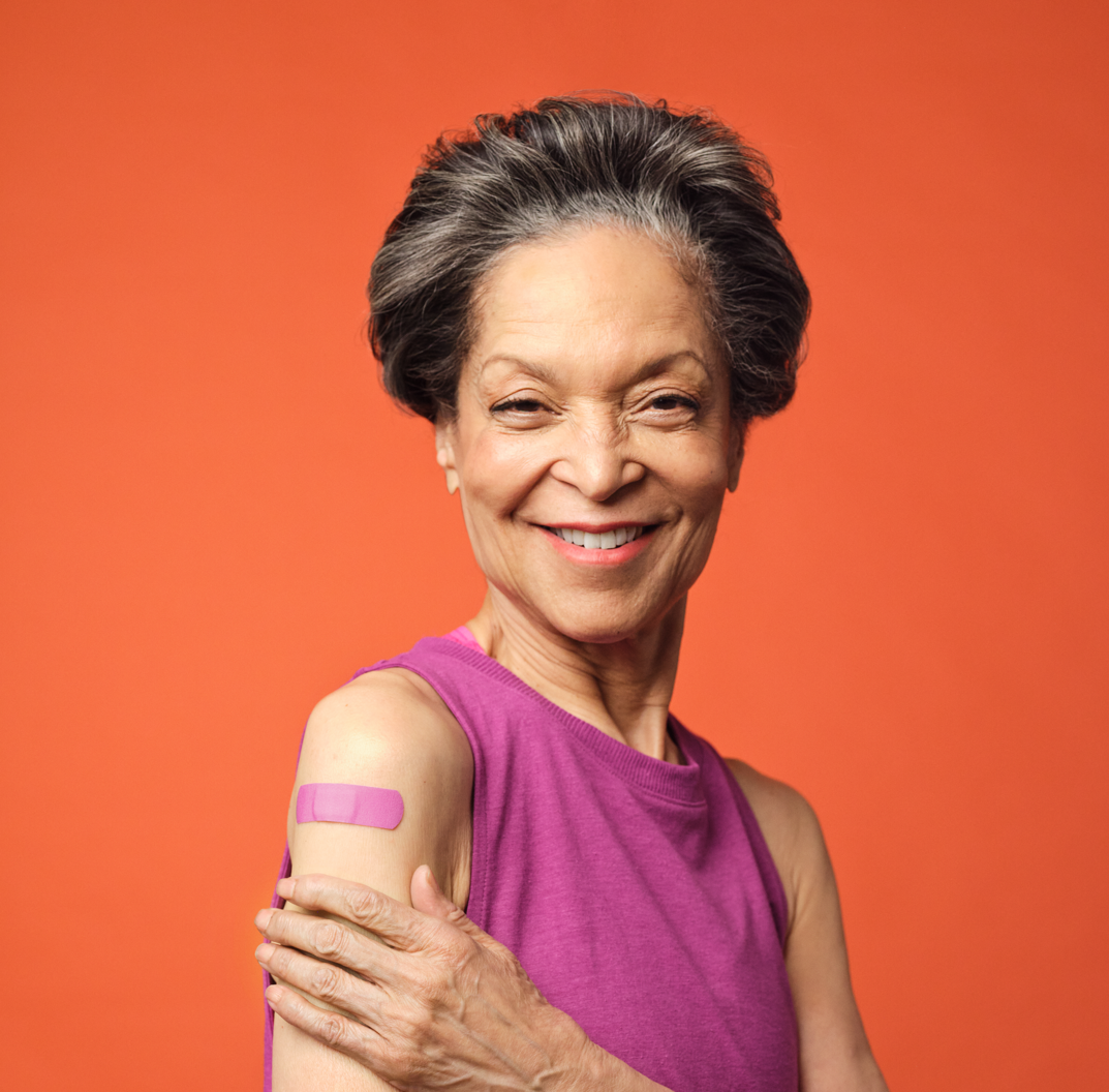 Woman 60+ getting her immunizations from Herself Health team member