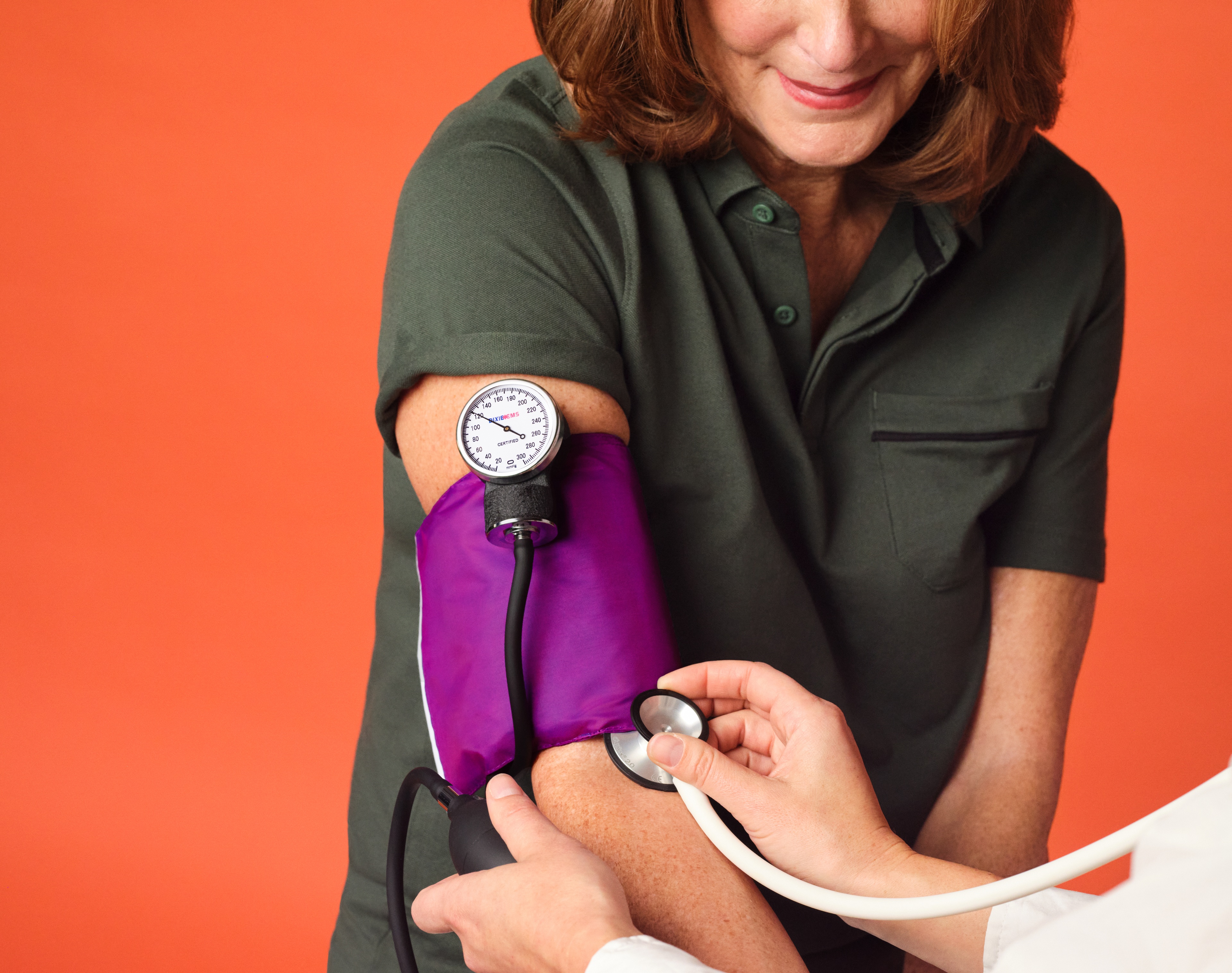 Woman 65+ having her blood pressure checked