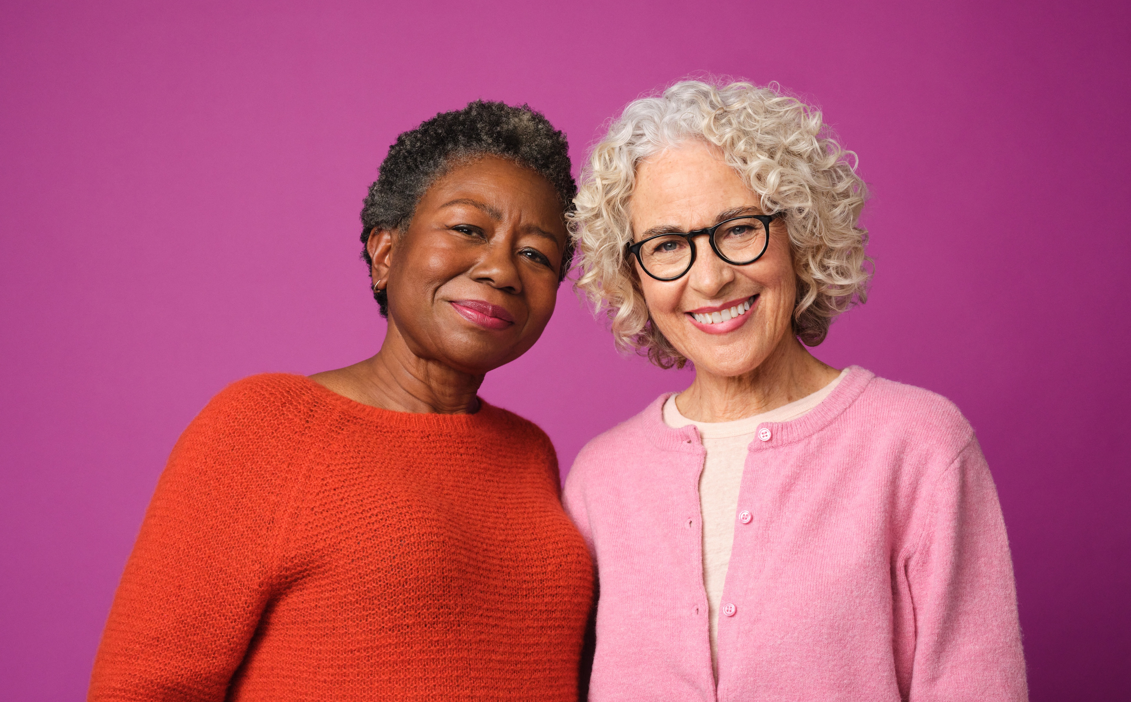 Two aging women smiling together