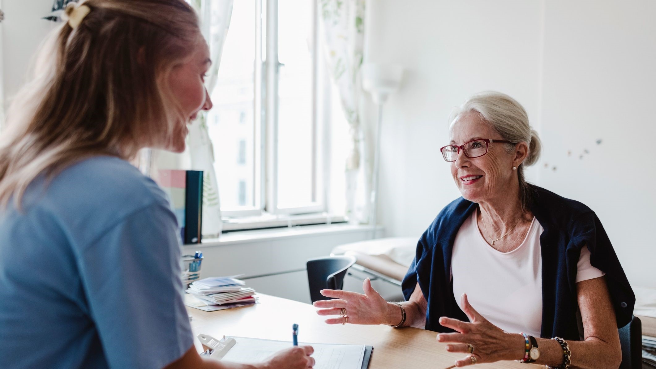 Woman and nurse talking