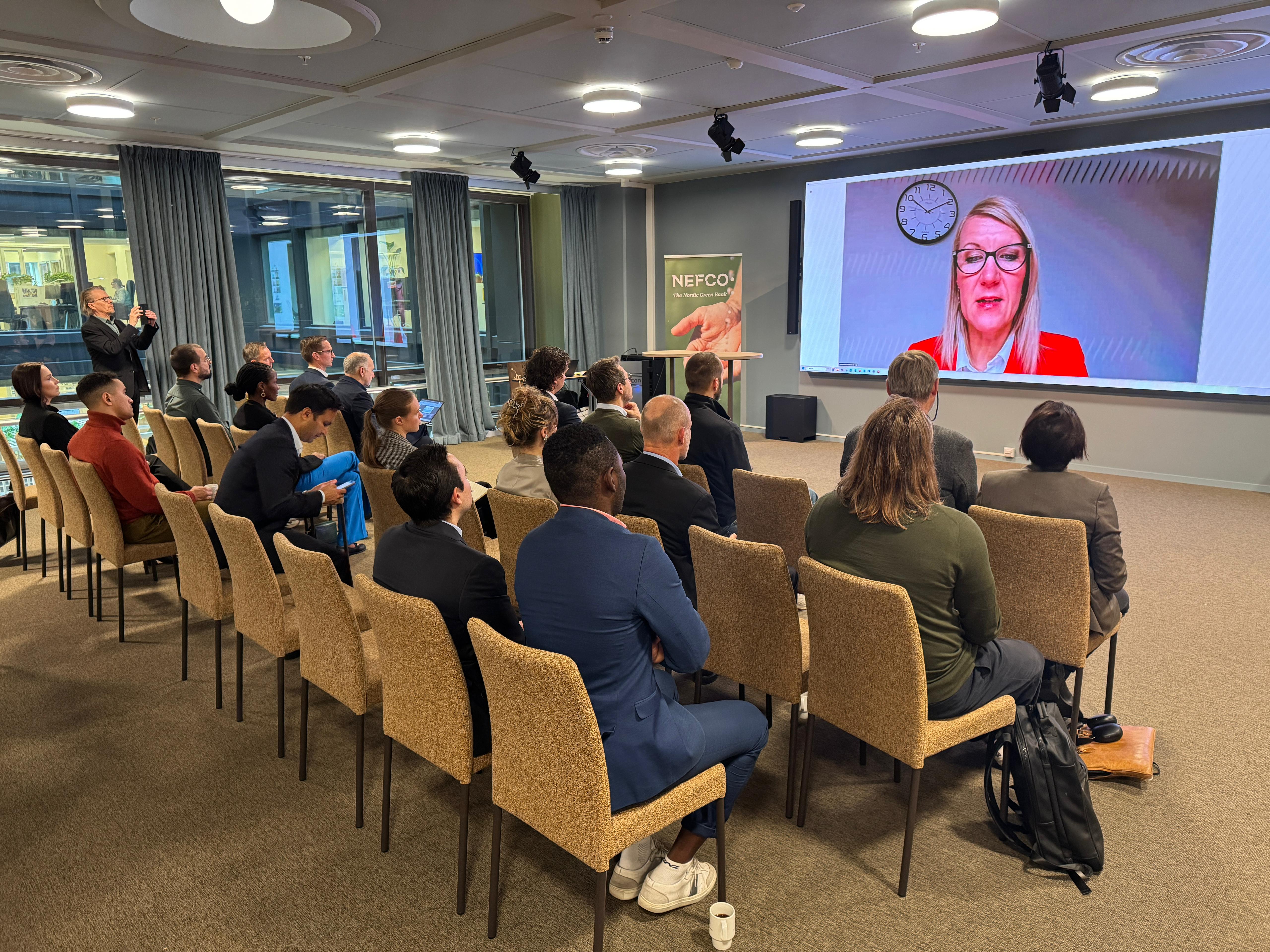 Minister Sari Multala speaking to the audience