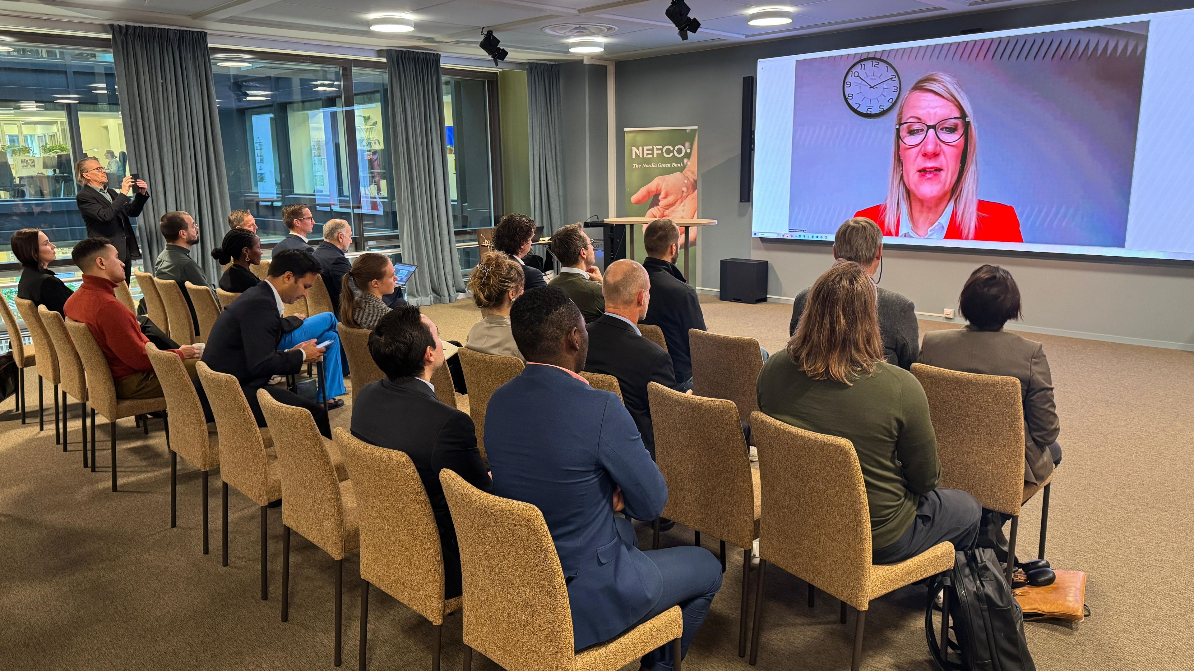 Minister Sari Multala speaking to the audience