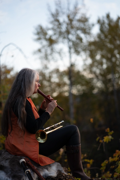 Kristin Andersen playing flute and trumpet