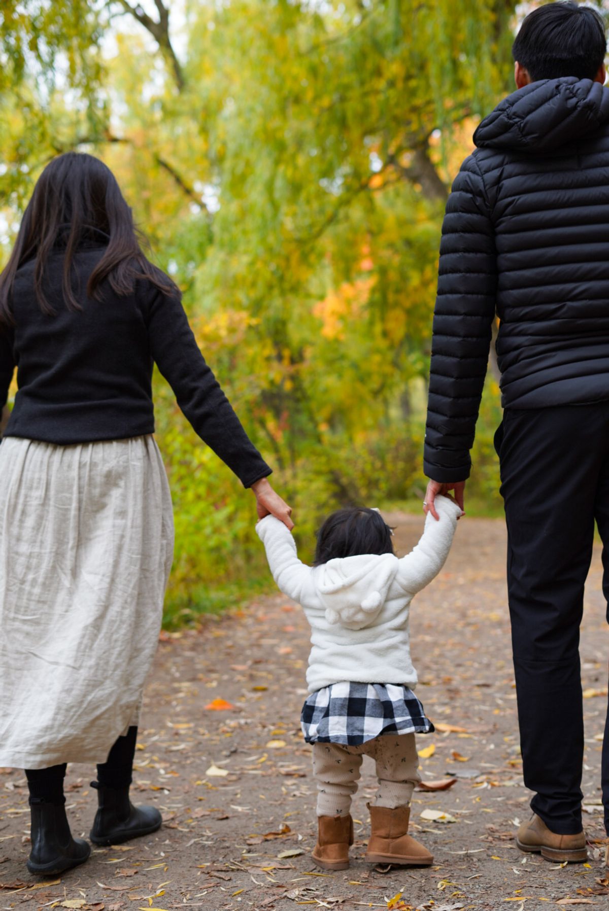 A family sharing a joyful outdoor portrait moment.