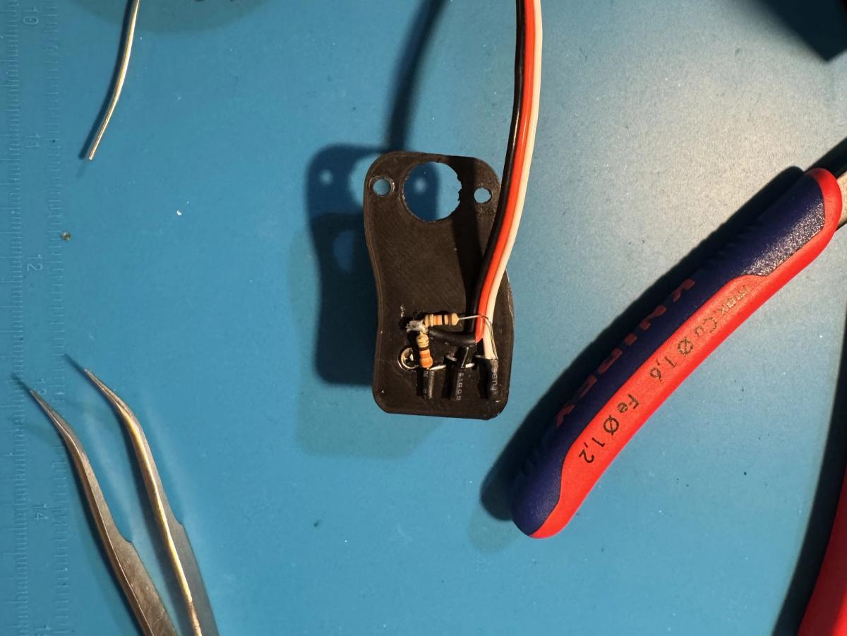 Underside of the sensor with the wiring connections and resistors visible