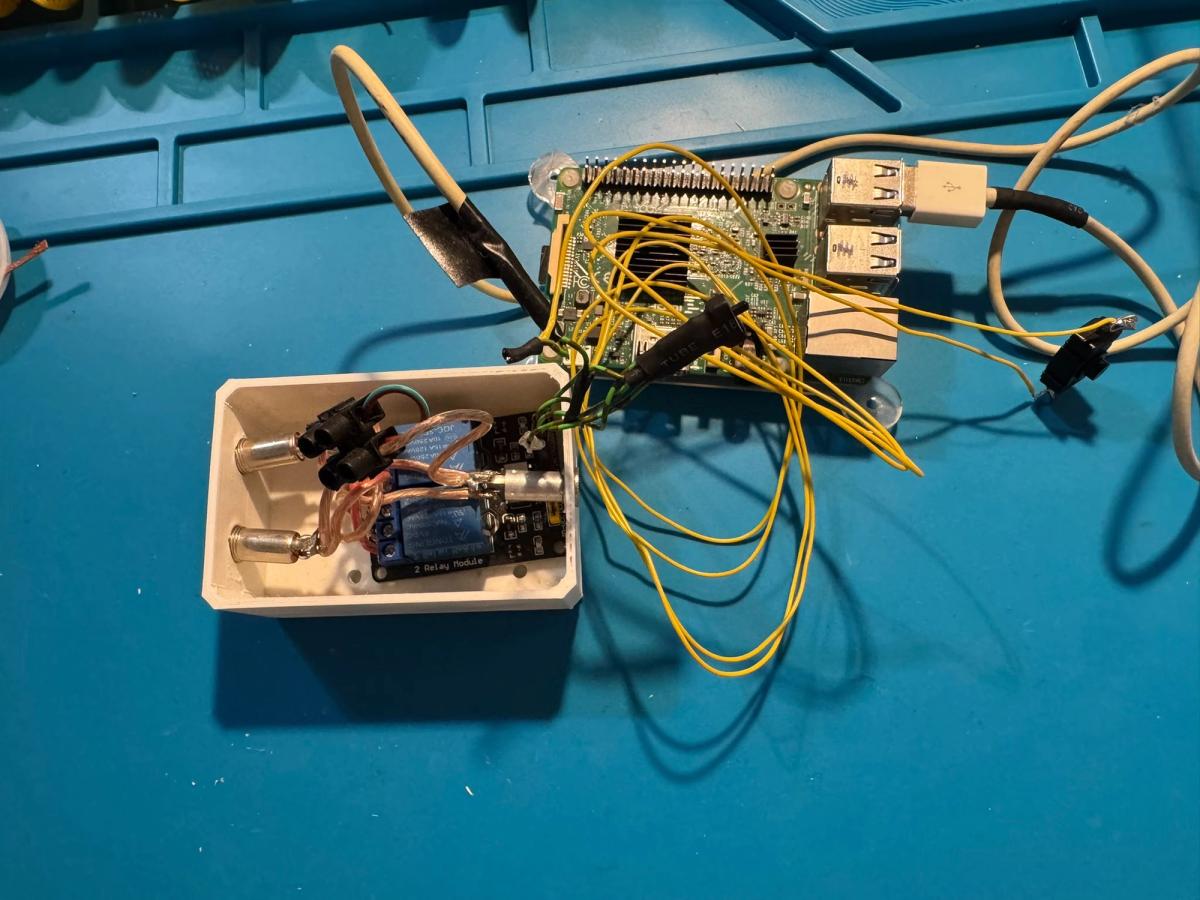 Original audio switching setup with a two-channel relay breakout board installed in a plastic enclosure and connected to a Raspberry Pi.