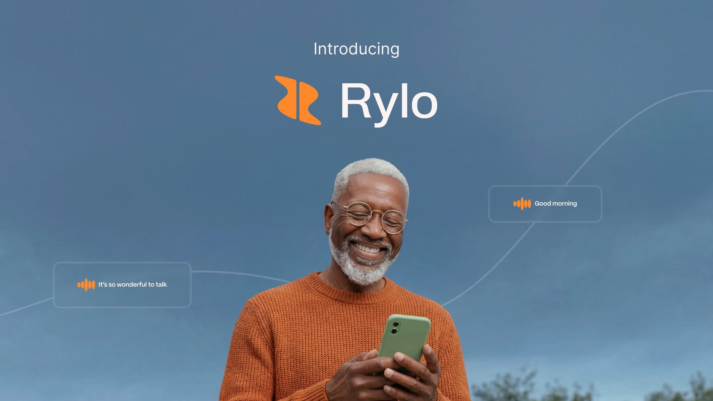 Promotional image for Rylo featuring a smiling older Black man with a gray beard wearing an orange sweater and holding a green smartphone outdoors. Text at the top reads “Introducing Rylo” with an orange logo.