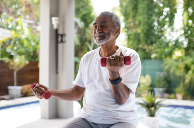 Senior man lifting dumbbells