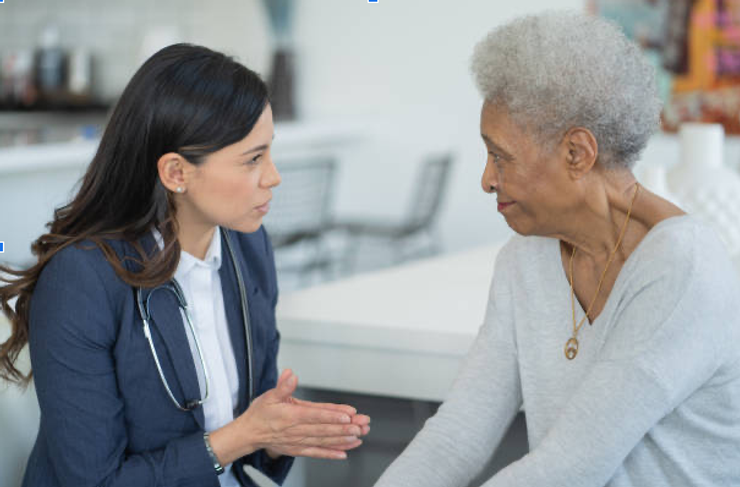 A woman getting help and guidance for soon-to-be-deaf situation.