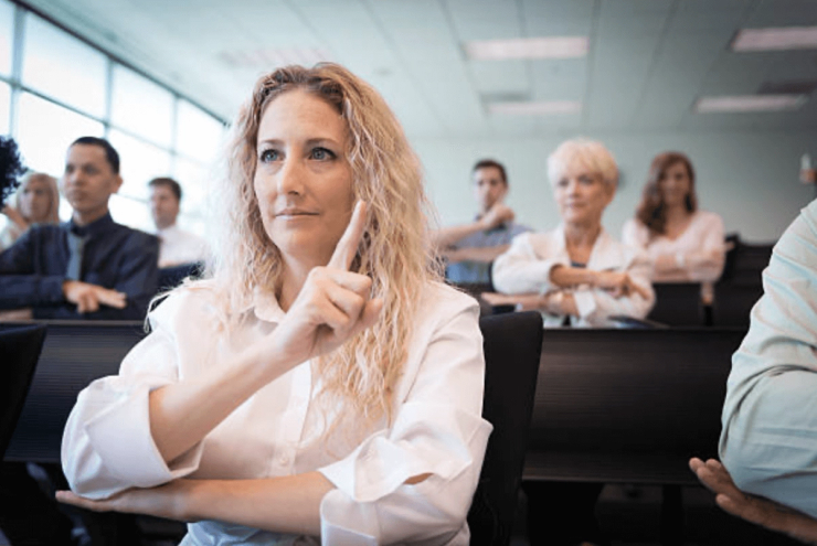 Woman speaking with the sign language.