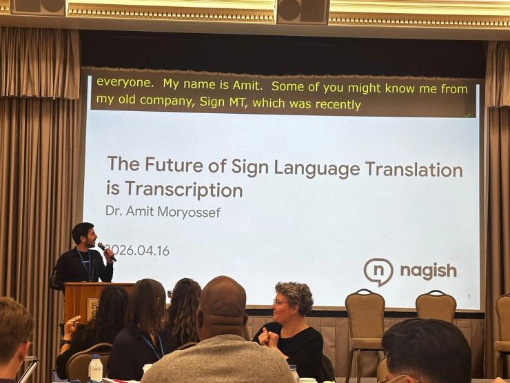 (Dr. Amit Moryossef giving a presentation at SlxAI 2026 in Boston University)