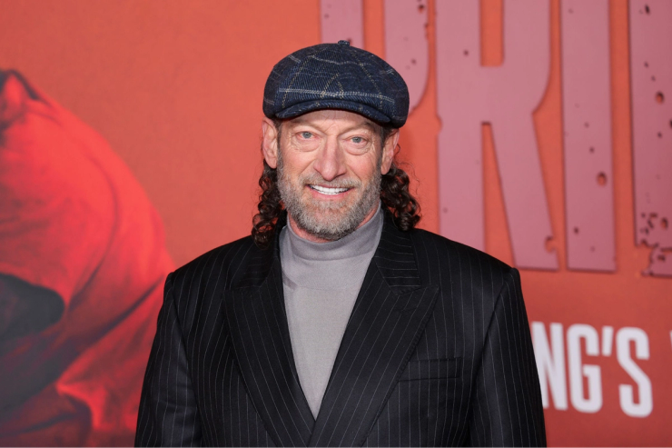 Troy Kotsur smiling at a red carpet event, Academy Award winning deaf actor known for his role in CODA