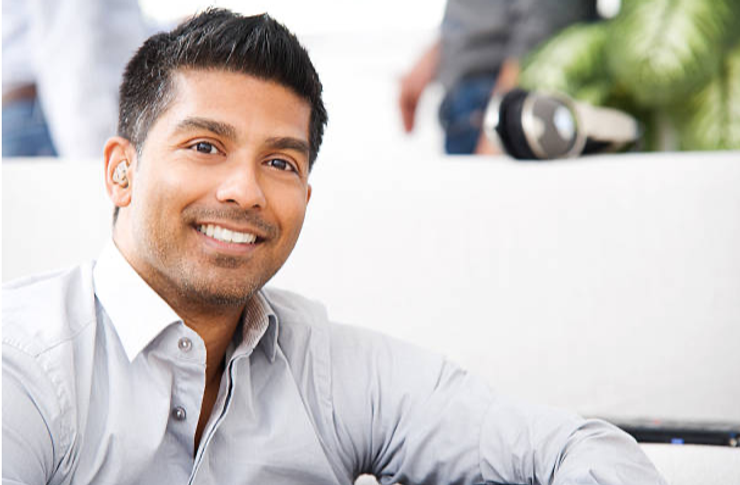 Young man with hearing aid.