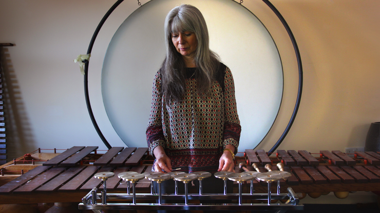 Evelyn Glennie playing percussion instruments, world renowned deaf musician who performs using vibration and sensory awareness