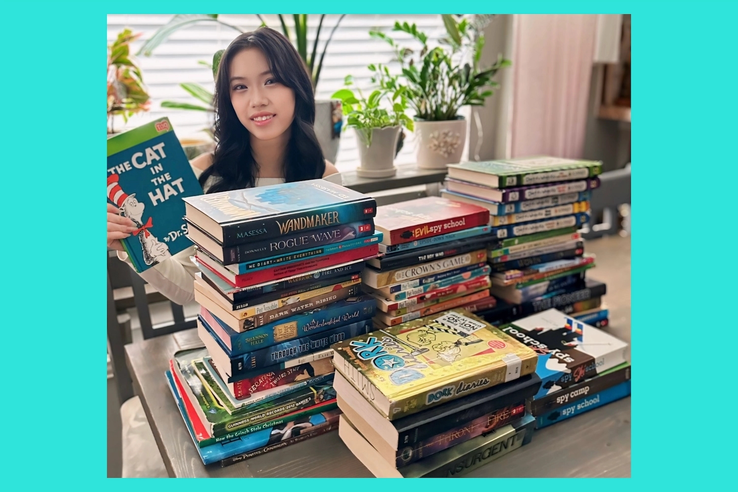 DoSomething member Delayla Nguyễnn volunteering and donating books in their community.