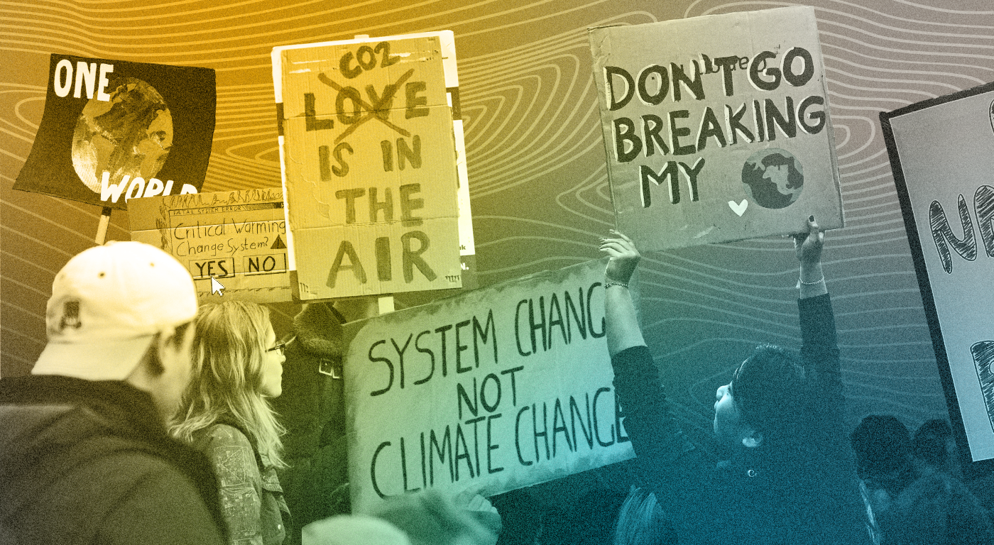 A group of young people protesting for climate action, carrying signs that read "one world", "system change not climate change", and "don't go breaking my heart"