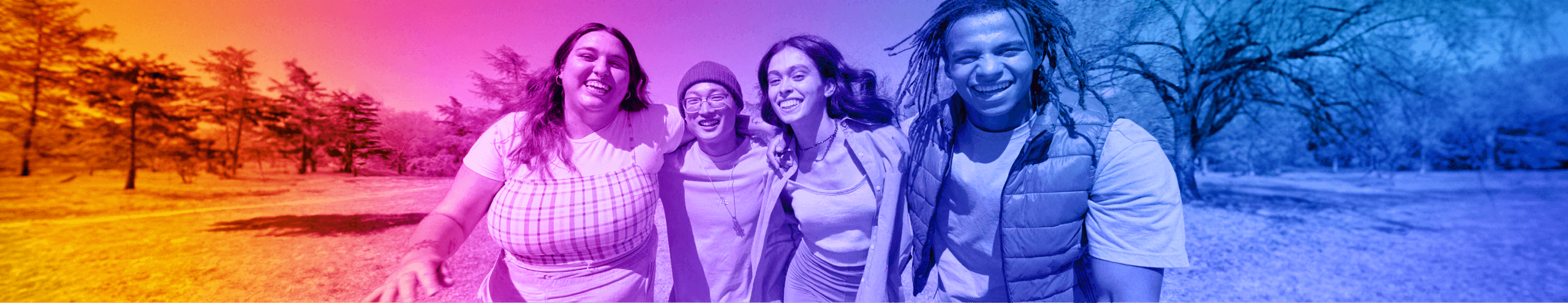 A colorful gradient photo of 4 diverse young people smiling and walking together in a park field