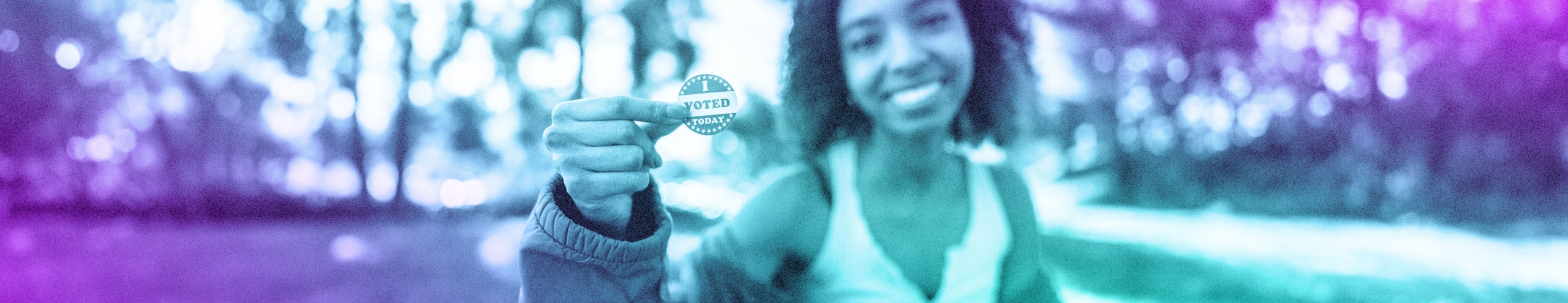 A purple-teal gradient photo of a young person in a park, holding up their 'I Voted Today' sticker