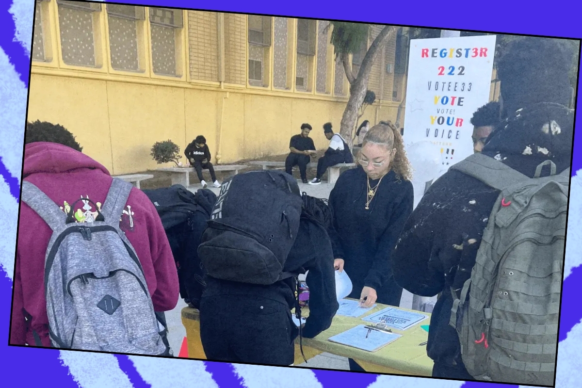Young people on their school campus registering to vote