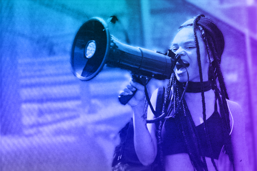 Young person speaking into a megaphone