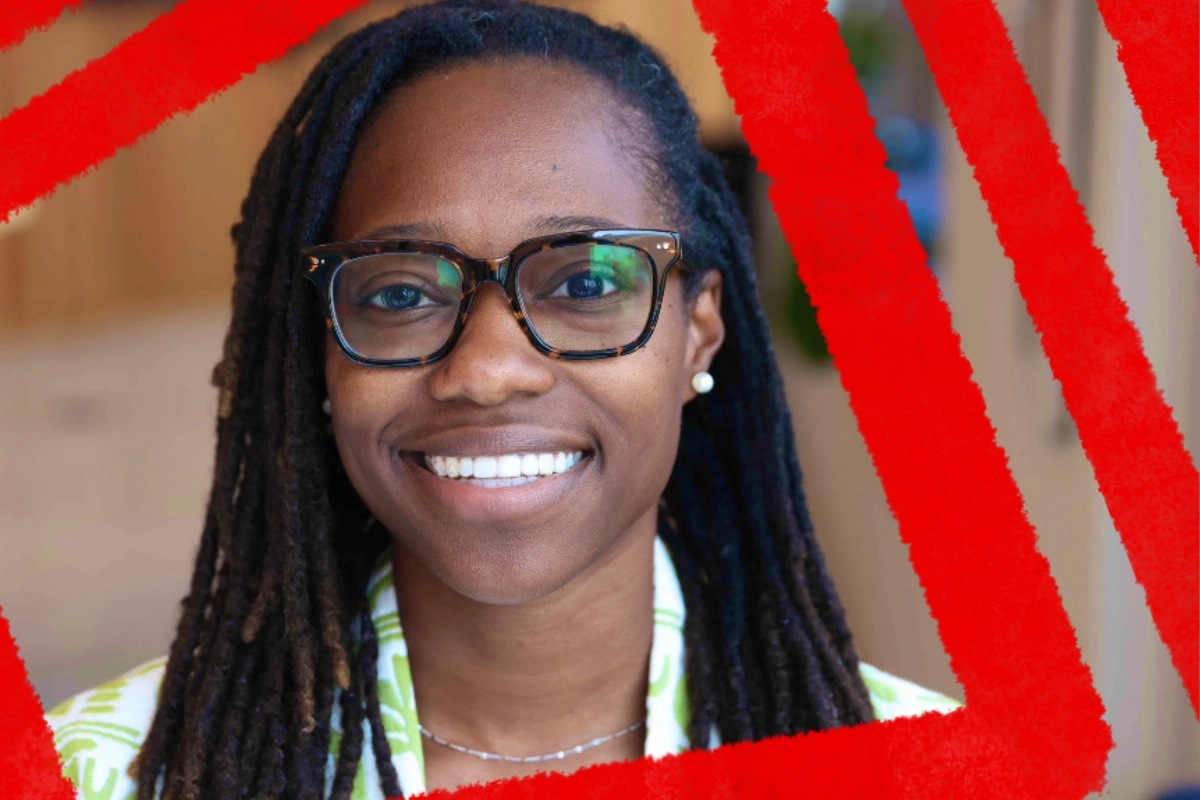 A smiling individual with glasses and long braided hair poses confidently, conveying a sense of community engagement. The background features a vibrant, red geometric design that adds emphasis to their welcoming expression.