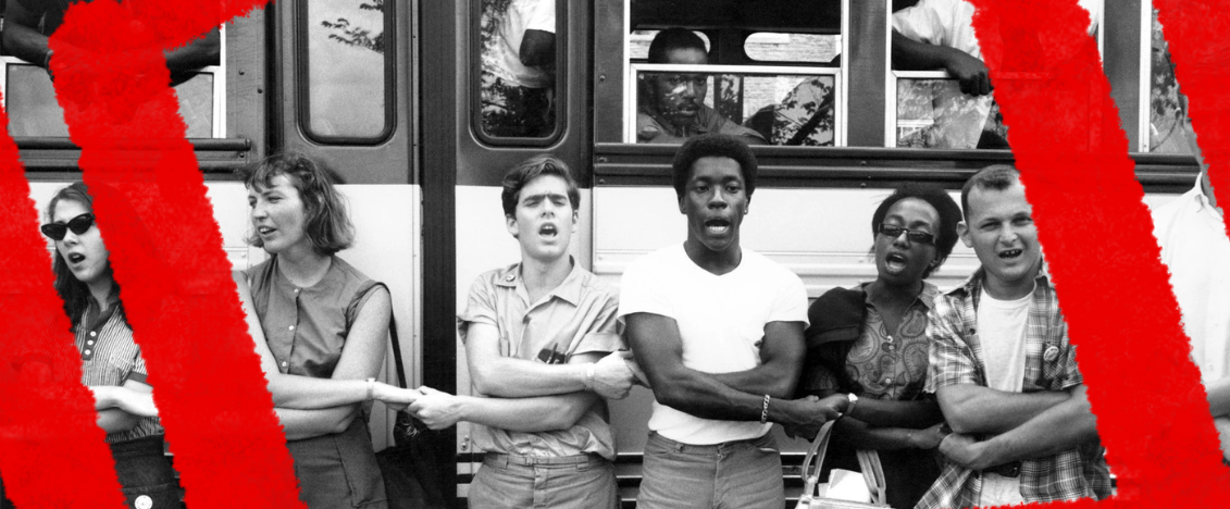 A black and white photo of young people holding hands in the Summer of Freedom Civil Rights movements of 1964 in Mississippi