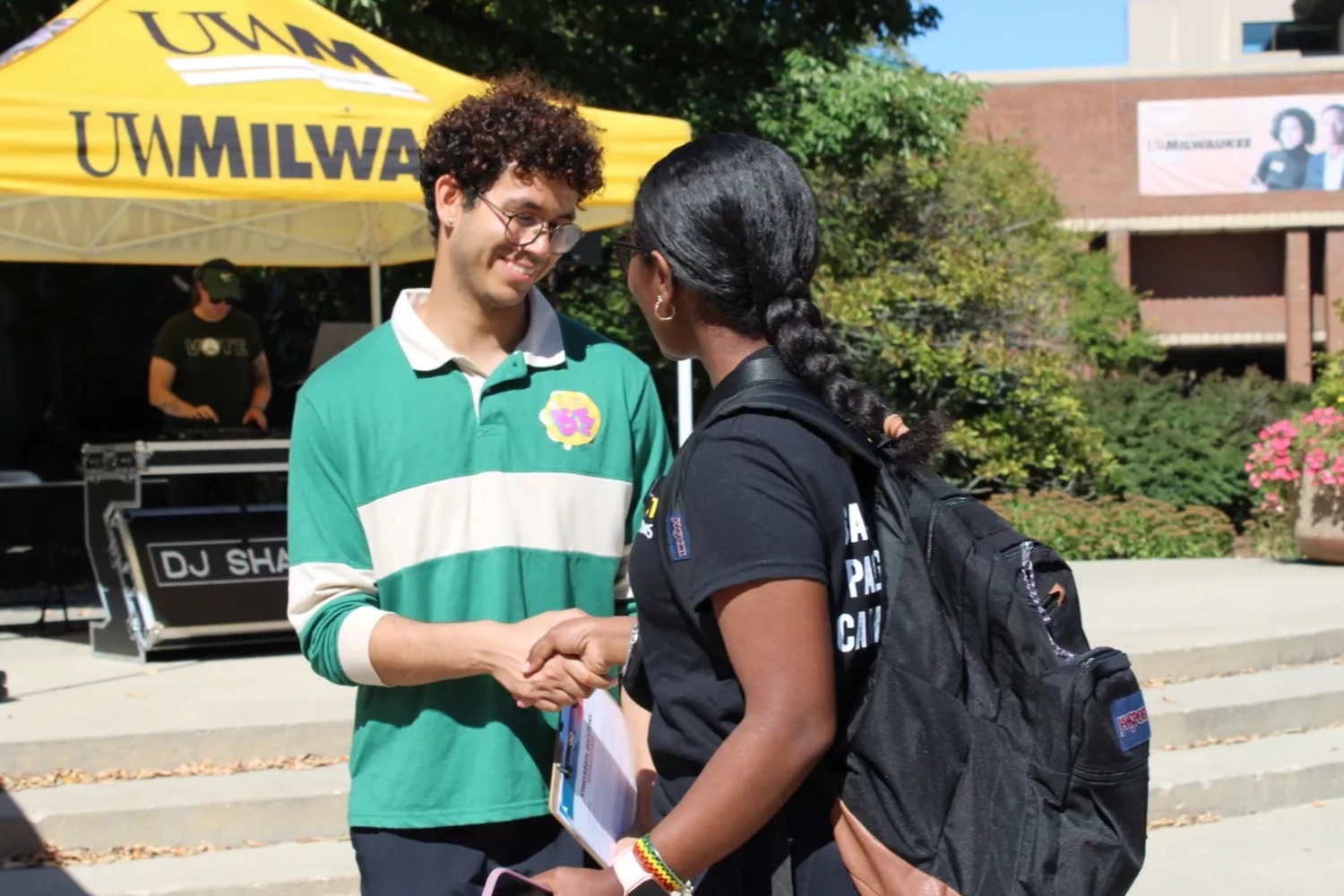 A DoSomething team member talks with a University of Wisconsin-Milwaukee student about their civic engagement.