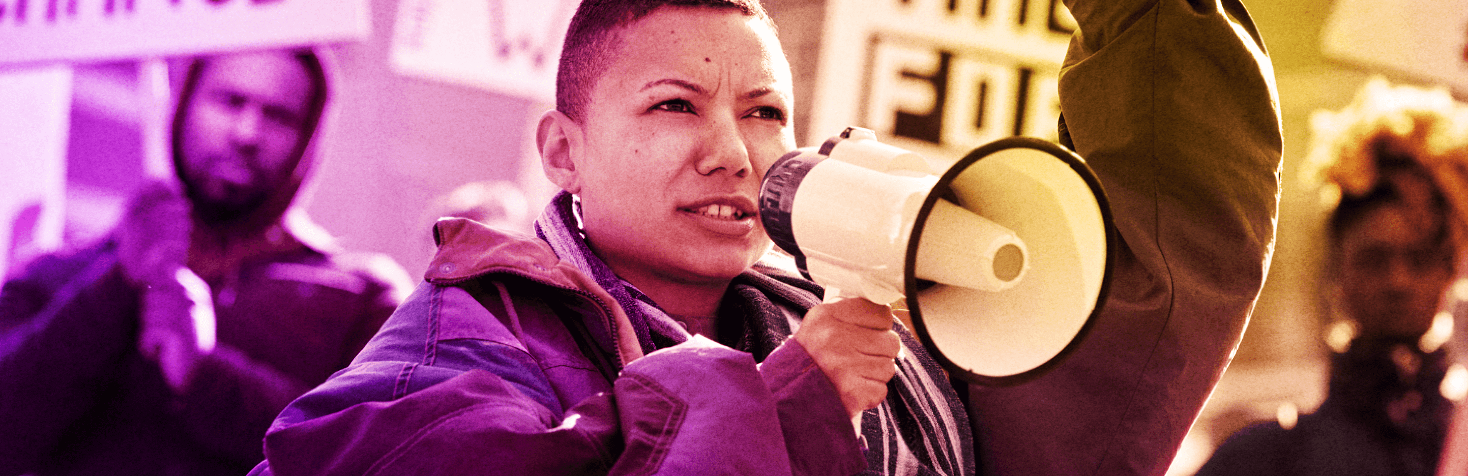 A purple and yellow gradient photo of young activists demanding change