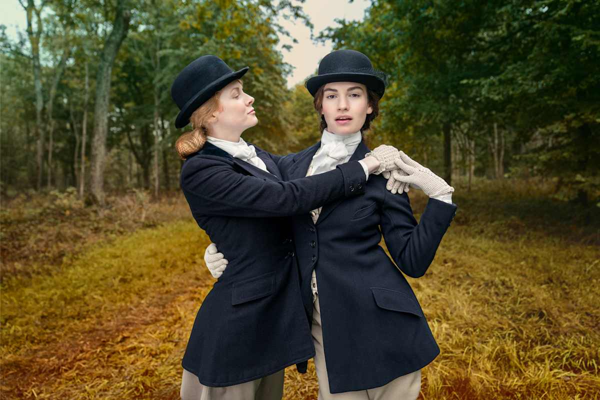 Emily Beecham as Fanny Logan and Lily James as Linda Radlett in The Pursuit of Love