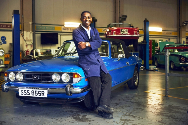 Colin Denton inside the classic car garage