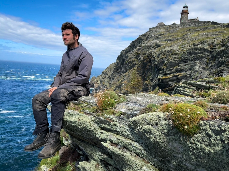 Guy Martin sat on a cliff ledge on the remote Calf of Man island.
