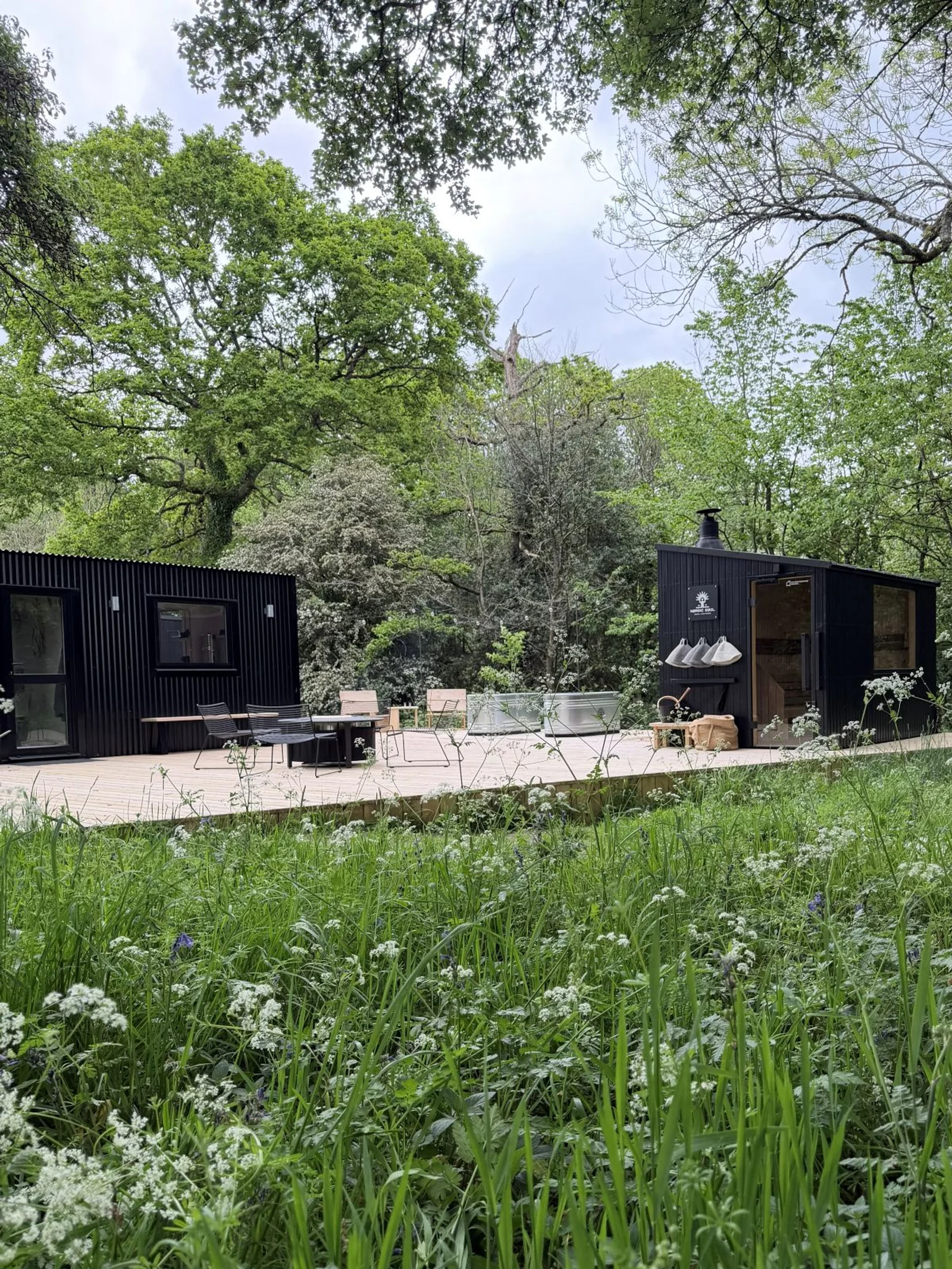 Nordic Soul Sauna's timber sauna and cold plunge tubs set in woodland near Shaftesbury, Dorset