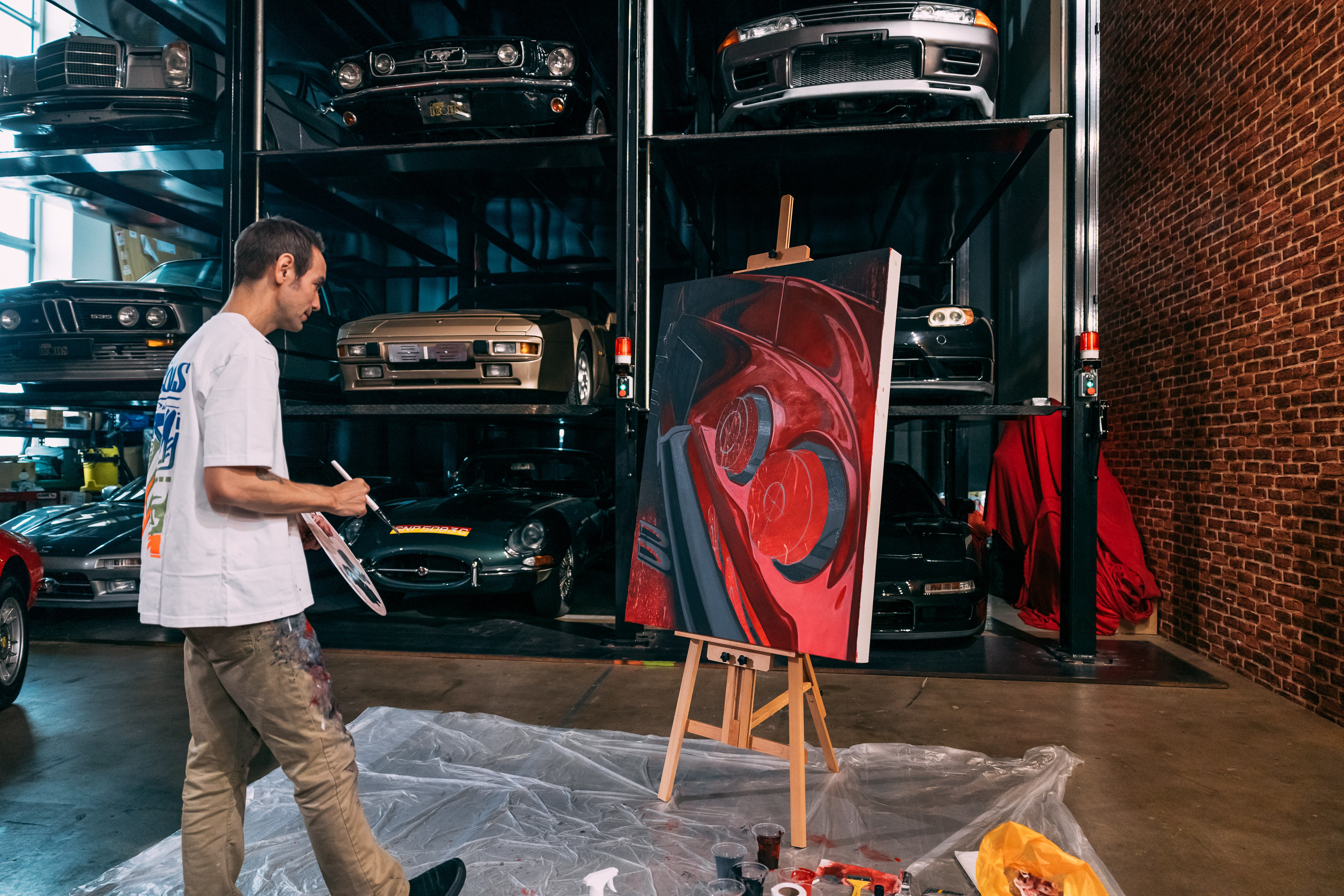 Chris Dunlop live painting on canvas at Auto Icons Showroom in Singapore