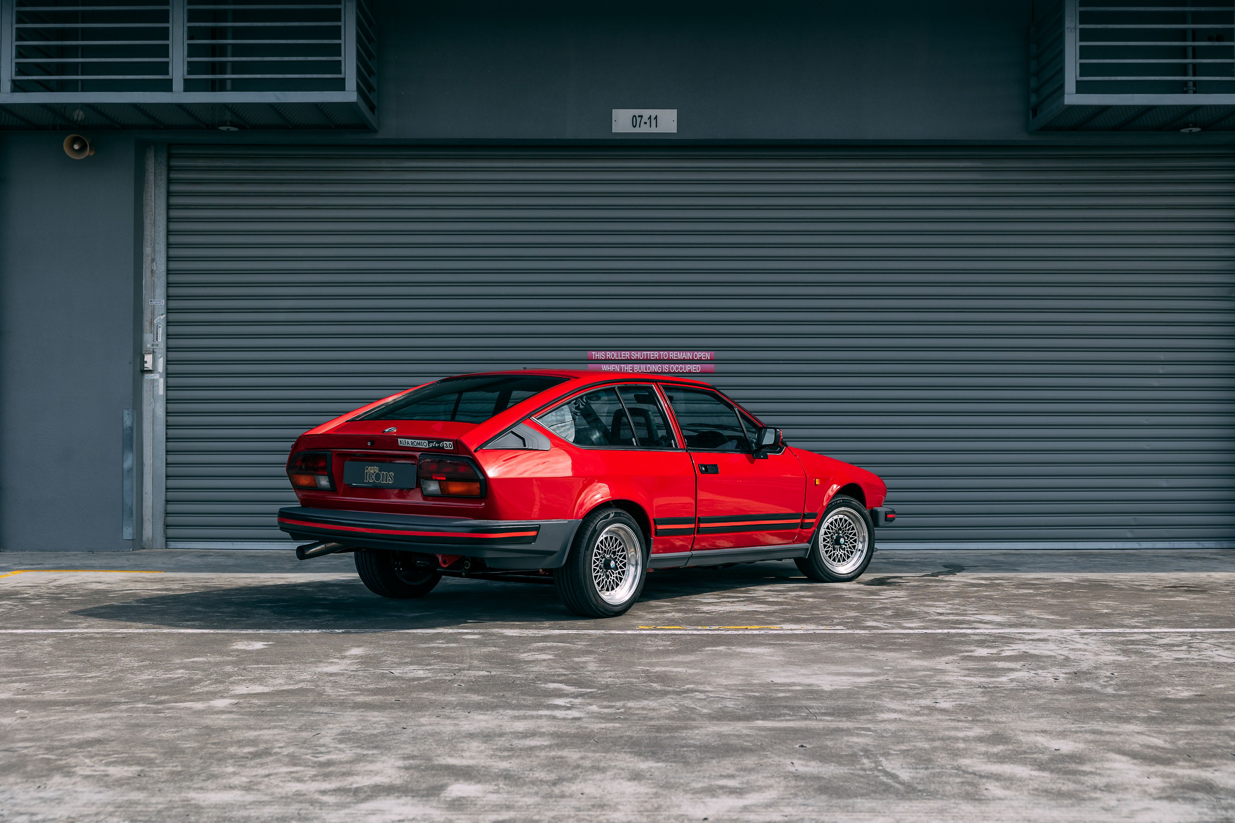 View the exterior of the 1985 Alfa Romeo GTV6 3.0 for sale (Red)