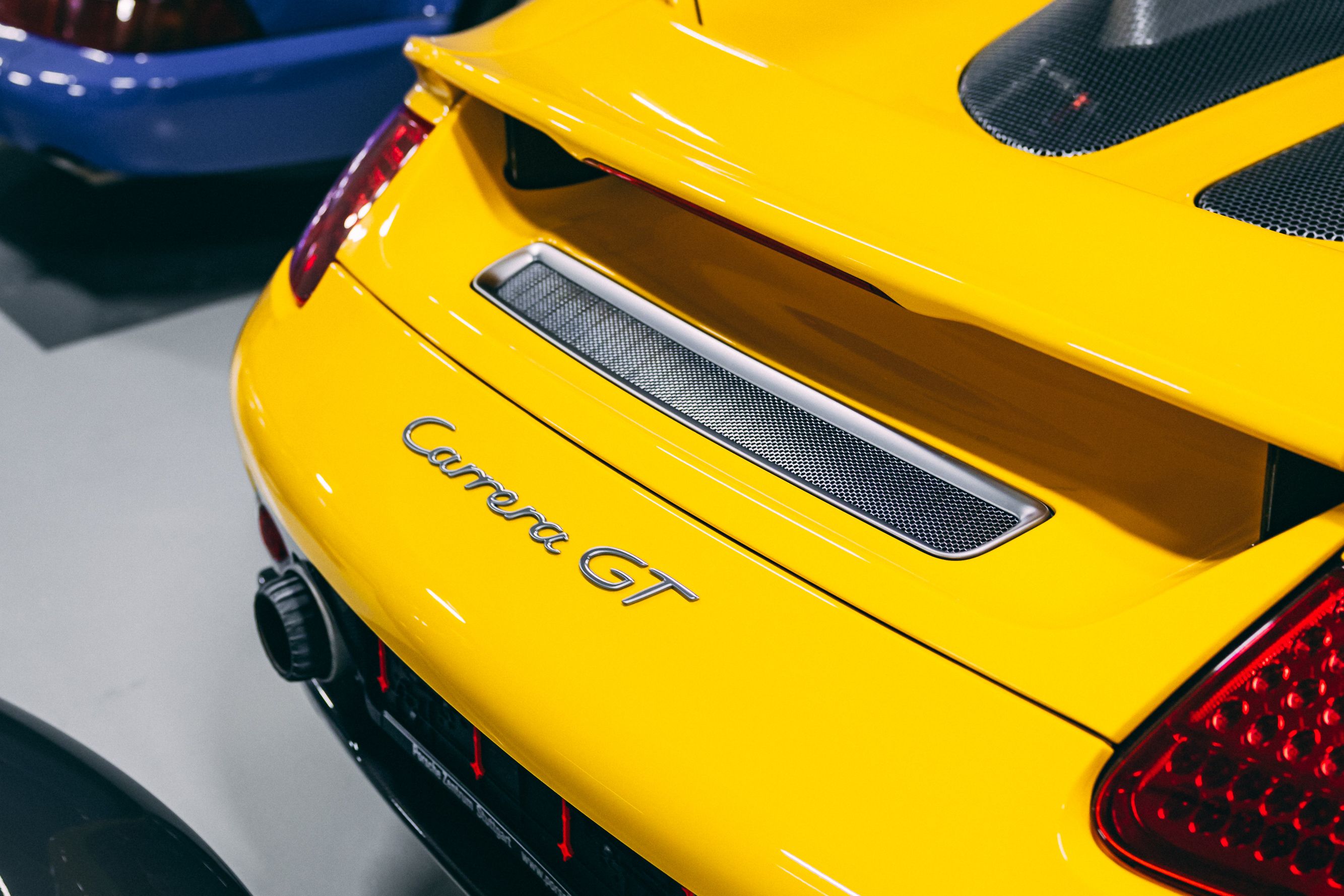 View the 2004 Porsche Carrera GT (Fayence Yellow) Exterior Back Image (1)