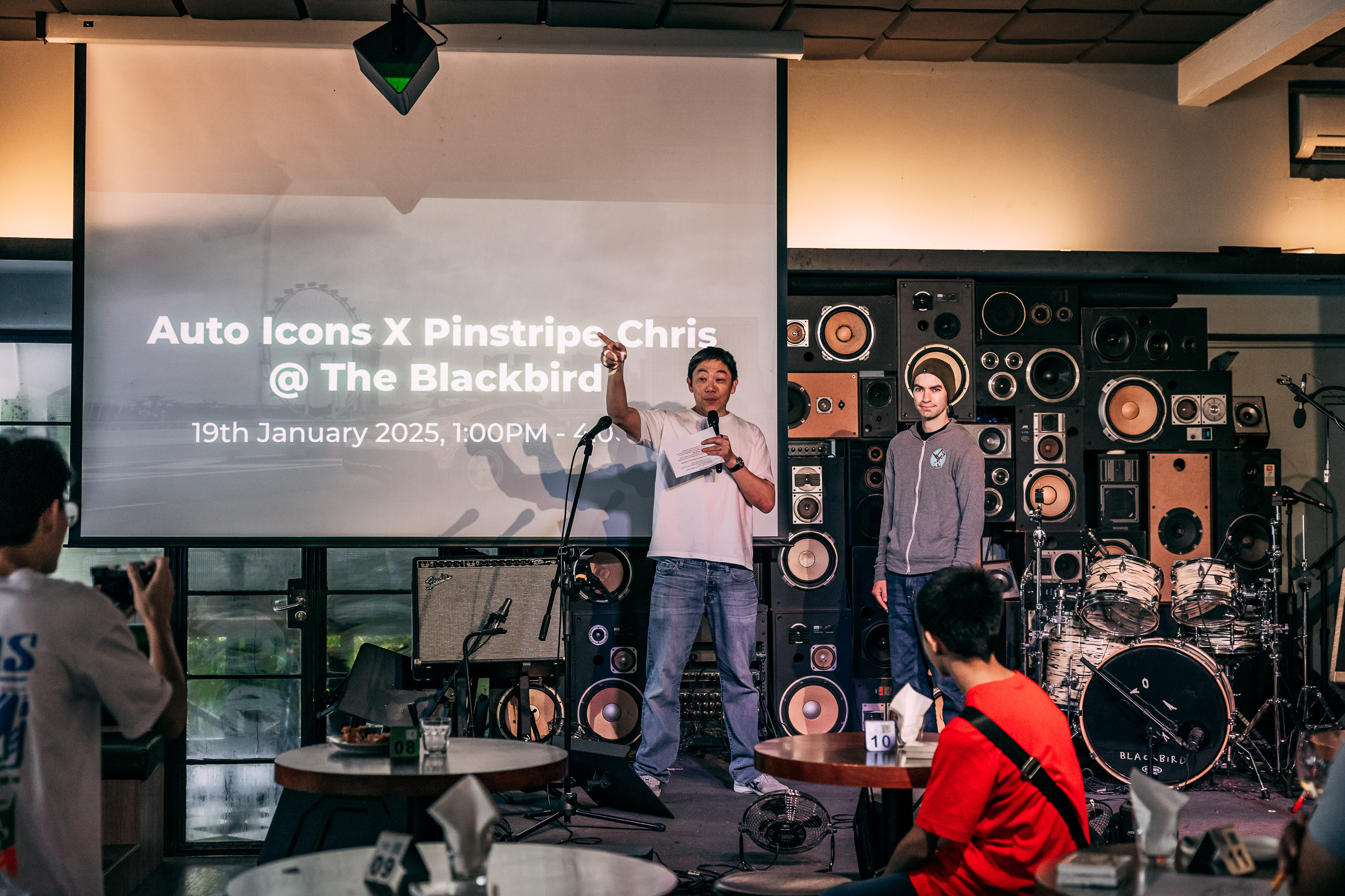 Colin Chow (Founder and Managing Director of Auto Icons) and Chris Dunlop (Automotive artist known as Pinstripe Chris) on stage