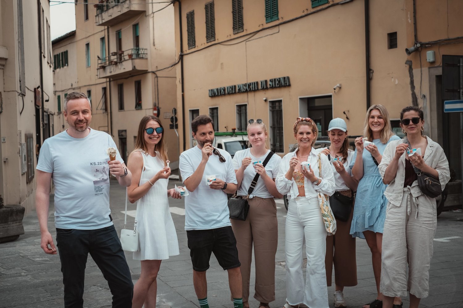 The team gathered in an Italian square with gelato in hand.